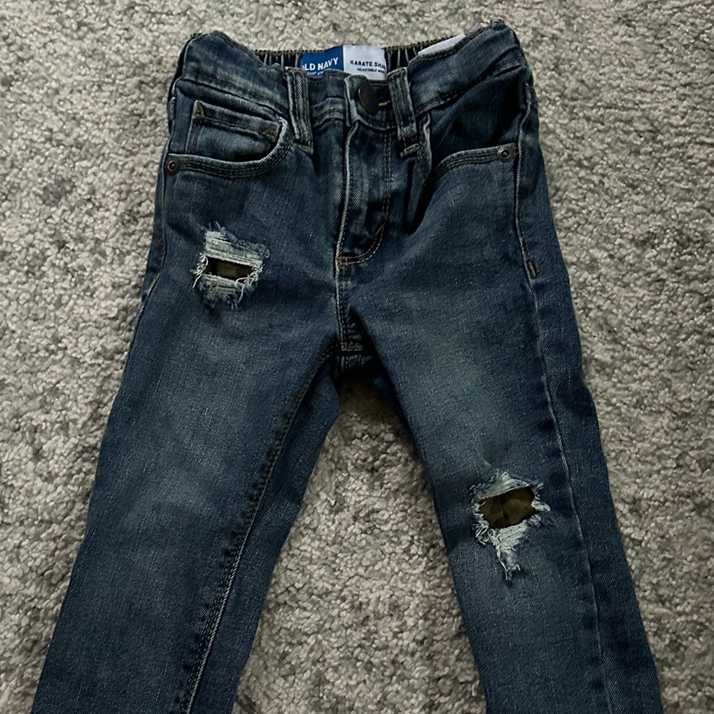 Ripped jeans with covered army print